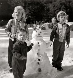 I don't know who these three lasses are, possibly nieces of my grandparents on my dad's side. I found it in their old photo album. I thought it was a neat photo, they look a little surprised to have their photo taken. View full size.