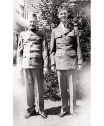 My grandfather and eldest uncle on the eve of my uncle's departure to the Pacific theater in WWII.  My grandfather served in France during WWI and was very proud to still fit into his uniform. Circa 1942, Connecticut. View full size.