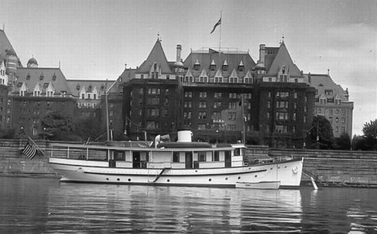 The Empress Hotel with the yacht Kuru in foreground. Victoria, BC. 1938. View full size.
