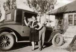 "Taken in front of Viola's place on the 25th of June." Not sure who Viola is except a friend of my grandma's family. I'm guessing the lady is Viola. View full size.