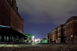 The derelict old wool store buildings in Newstead, Brisbane, Australia.
A four minute exposure taken at around 3am one evening in 1984. Well before the area was modernised and turned into studio apartments. View full size.
Still of the nightNice feel..great color...like a scene from a movie..something is going to happen
Beautiful Colour and Aspect RatioIt almost looks like someone colorised it very carefully. (FYI: I tried to use AU spelling just for you.)
AromasI will never forget the smell of the Geelong Wool Stores on a hot summer day back in the late 1950s when we lived there. Add to that the steam locos shunting onto the adjacent piers and what more could a 12 year old ask for. I would go down to the West Geelong rail yards with a friend, and from the pedestrian overpass we watched the action. When I got home my mother immediately knew where I'd been from the coal smoke smell in my clothes. We visited Brisbane when the trams and trolley buses were still running. Not to mention the old swing-door suburban carriages. 
(ShorpyBlog, Member Gallery)